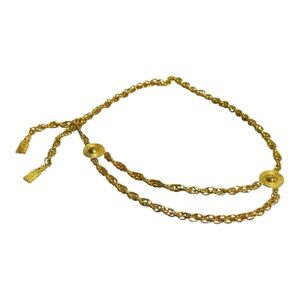 Vintage gold-tone chain belt featuring multiple chain strands medallion accents